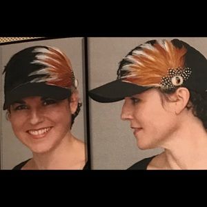 Black ball cap with brown/white/black feathers